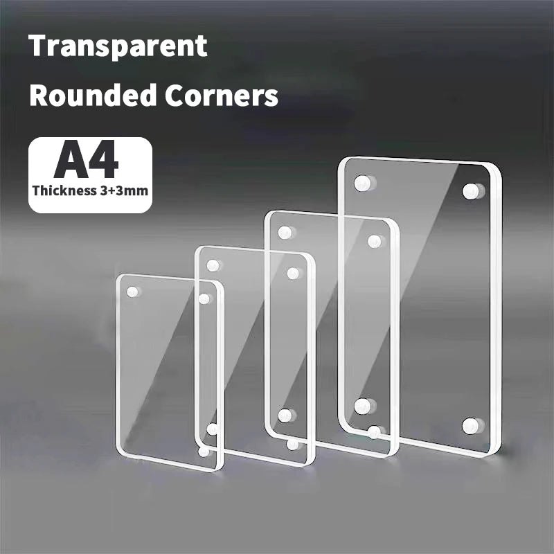 A set of transparent acrylic photo frames with rounded corners displayed on a gray surface.