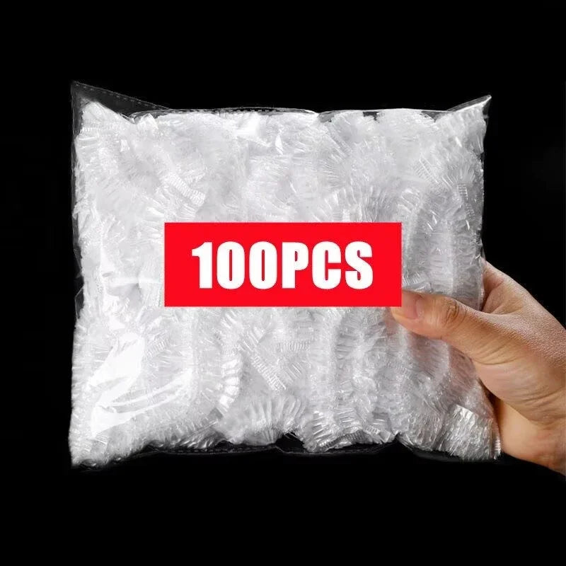 A hand holds a clear plastic bag filled with 100 reusable plastic food wrap covers.