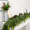 Two pieces rendering of an extra long pine vine wreath for holiday decor with greenery and candles