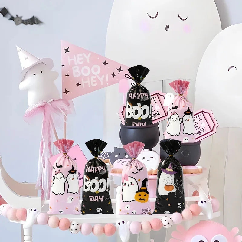 A display of Halloween candy treat bags featuring a little boo design, including black and pink bags, on a white background.
