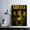 A poster featuring the word NIRVANA in yellow text over a black and white image of the band members.