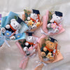 Handcrafted crochet flower bouquet featuring a teddy bear in a graduation cap