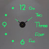 A minimalist clock face with green hour markers and hands showing a time near 12:00.