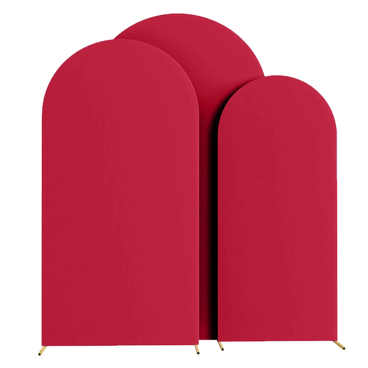 Three vertical, curved red fabric arch stands used as a backdrop for wedding and event decor.