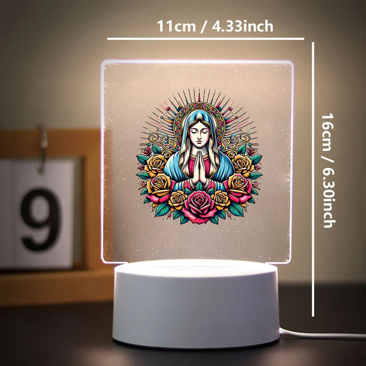 A square 3D LED night light featuring a serene female face surrounded by floral and radiant patterns.