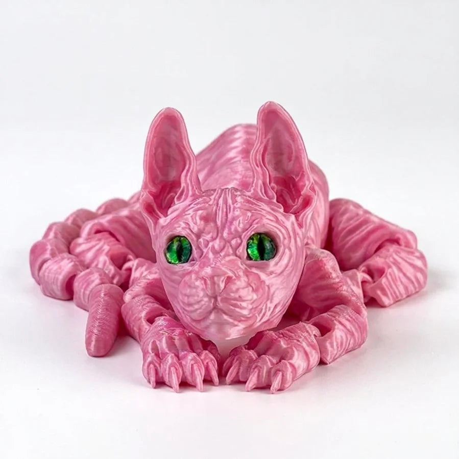 A pink articulated sphynx cat figurine with green eyes, shown in a close-up view.