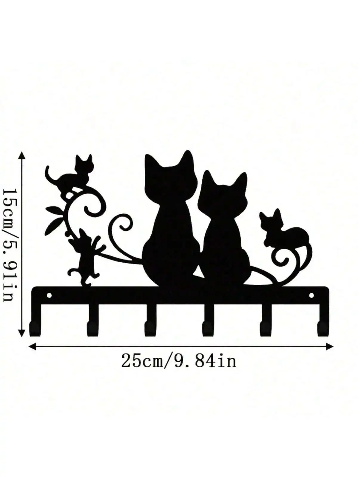 Black silhouette wall decor featuring three cats and decorative swirls on a wooden plank.