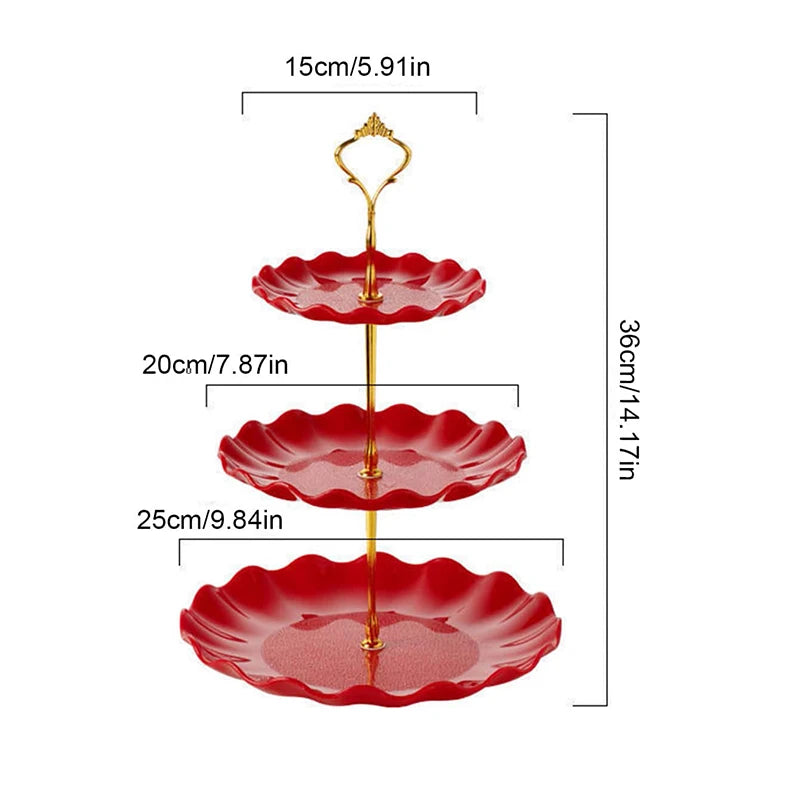 A two-tier serving stand with red ceramic plates for desserts and fruit.