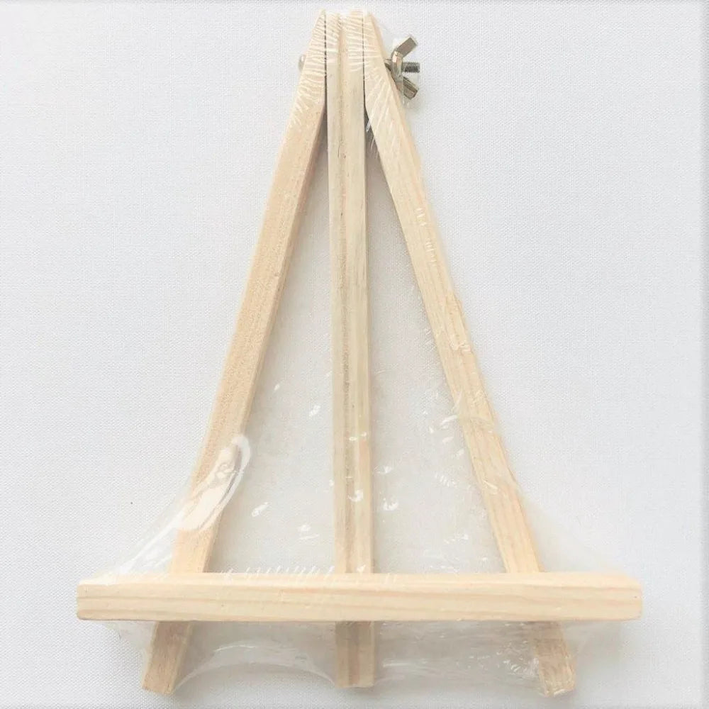 A wooden message board frame with a slanted support and a horizontal base, made of light wood.