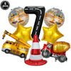 Eight construction truck foil balloons and a red and white traffic cone for birthday party decor