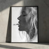 Black and white portrait of a woman with long hair smoking a cigarette