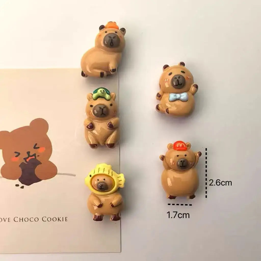 A set of adorable guinea pig refrigerator magnets featuring various expressions and colors.