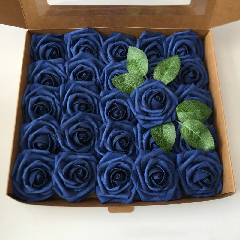 A box filled with dark blue artificial foam roses and green leaves for DIY floral decor.