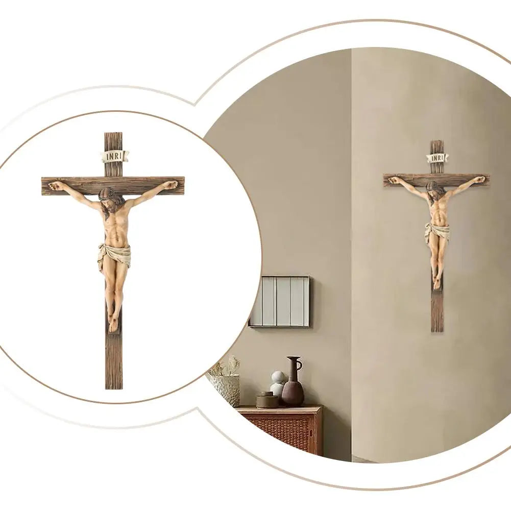 A hand-painted resin cross statue with a figure of Jesus Christ is displayed on a wall.