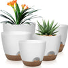 A set of five white self-watering flower pots with brown accents, featuring vibrant orange and yellow flowers.
