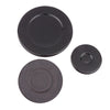 A set of two round, black gas stove burner caps, one glossy and one matte.