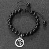 A black beaded bracelet with a silver pendant featuring the zodiac sign Virgo.