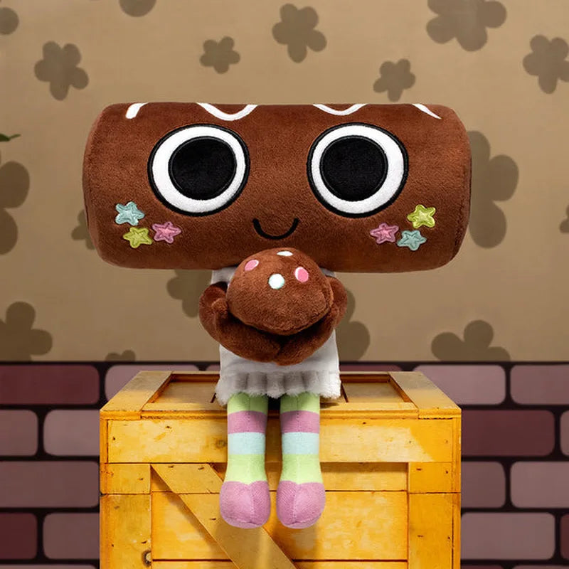 A brown plush toy with large eyes and a small figure standing on a yellow wooden box.