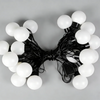 A cluster of large, spherical white marquee lights with black wiring for party decoration.
