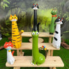 A collection of cat-shaped resin vases in various colors and styles displayed on wooden shelves.