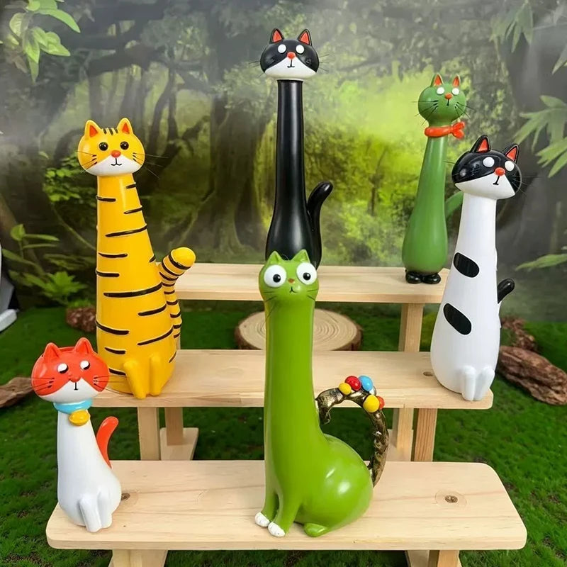 A collection of cat-shaped resin vases in various colors and styles displayed on wooden shelves.