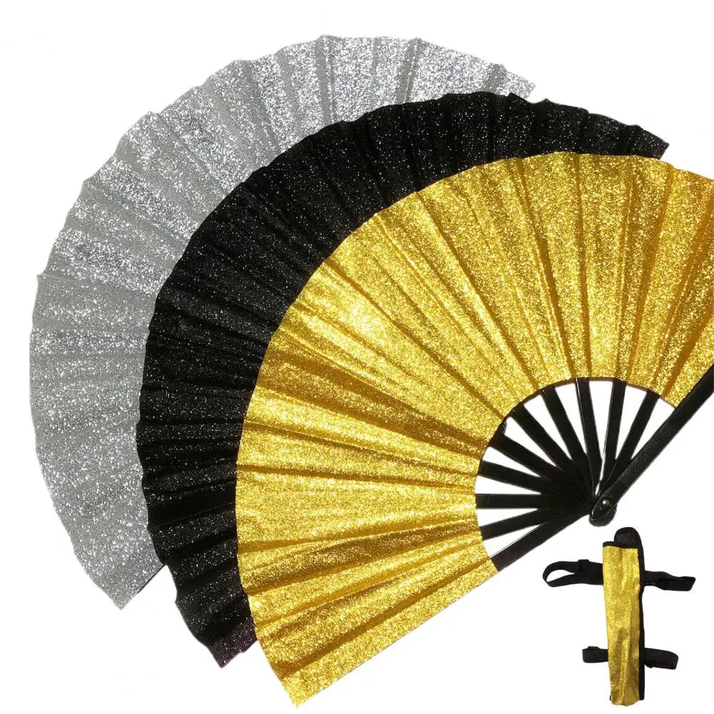 A hand fan with layered paper blades in silver, black, and gold glitter holographic finishes.