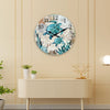 A round wall clock featuring a design of sea turtles in various shades of blue and green on a light background.