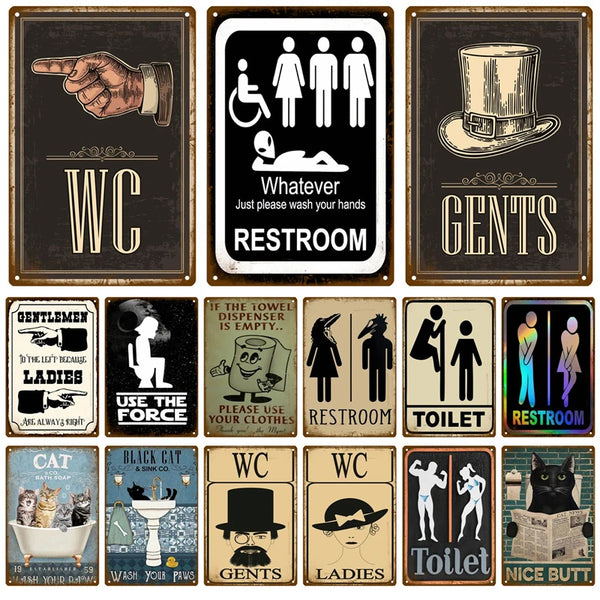 A collection of vintage metal signs for bathroom decor featuring labels like WC, GENTS, LADIES, and TOILET.
