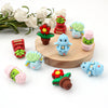 A collection of colorful 3D silicone plant beads shaped like flowers and leaves for jewelry making and DIY crafts.