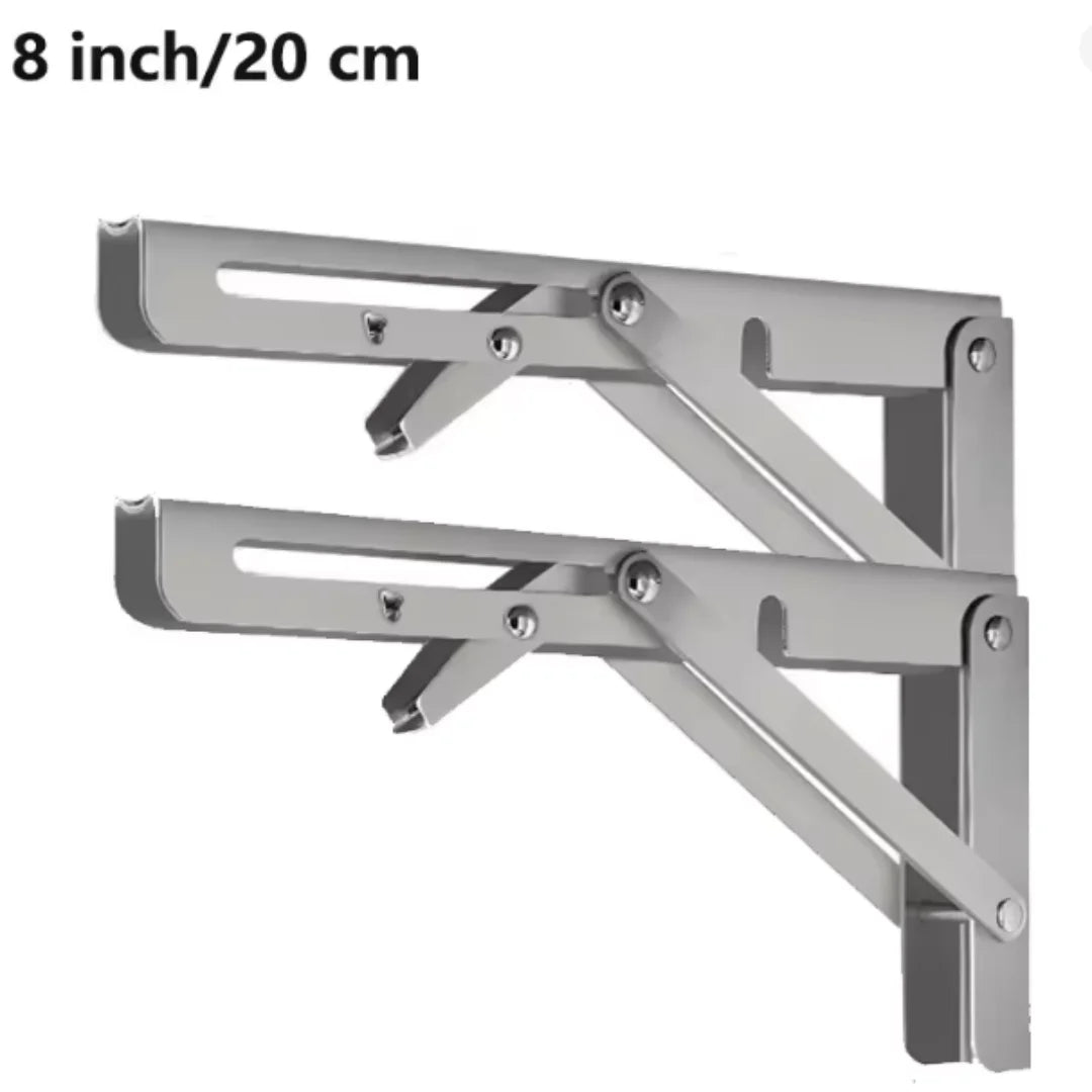 A pair of silver heavy-duty foldable wall-mounted shelf brackets shown in a close-up view.