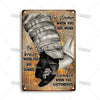 Vintage firefighter metal sign with inspirational text on distressed brown background
