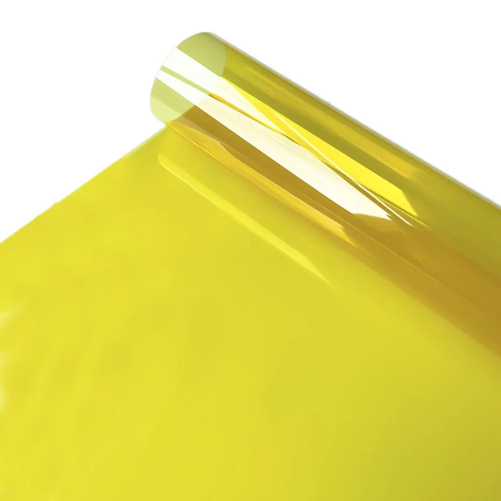 Close-up of a sheet of bright yellow decorative stained glass window film.
