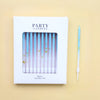 A white box containing a set of 24 party candles with iridescent blue and green hues.