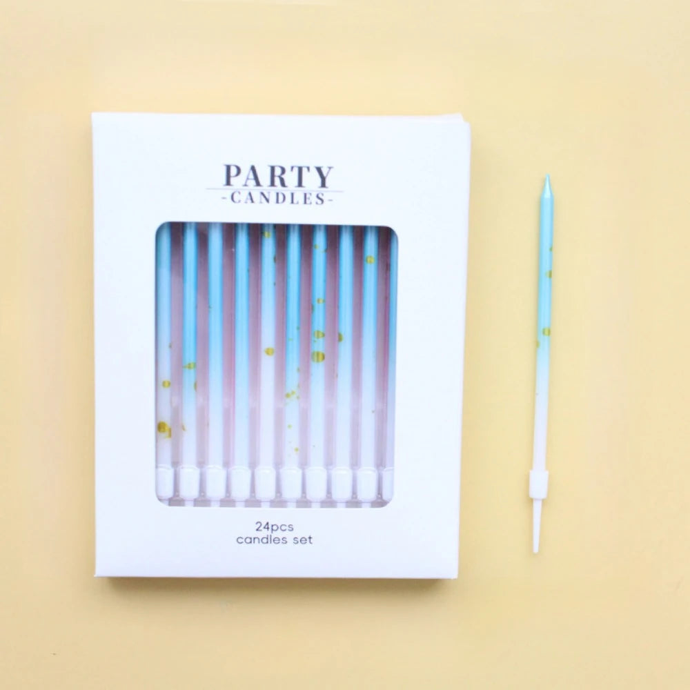 A white box containing a set of 24 party candles with iridescent blue and green hues.