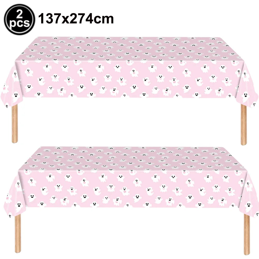 Two pink ghost patterned tablecloths for a Halloween party table set