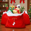 A festive display of red velvet Santa Claus gift bags filled with Christmas ornaments and wrapped presents.