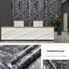Matte sandstone gray self-adhesive waterproof wallpaper used as a kitchen and furniture finish