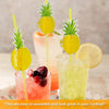 A glass cocktail featuring a pineapple garnish and tropical paper straws.