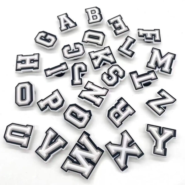 A collection of alphabet letter shoe charms for Crocs in various styles and sizes.