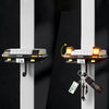 A classic car headlight key holder with LED illumination is displayed against a dark background.