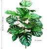 Artificial Monstera plant with silk green leaves displayed against a white background.