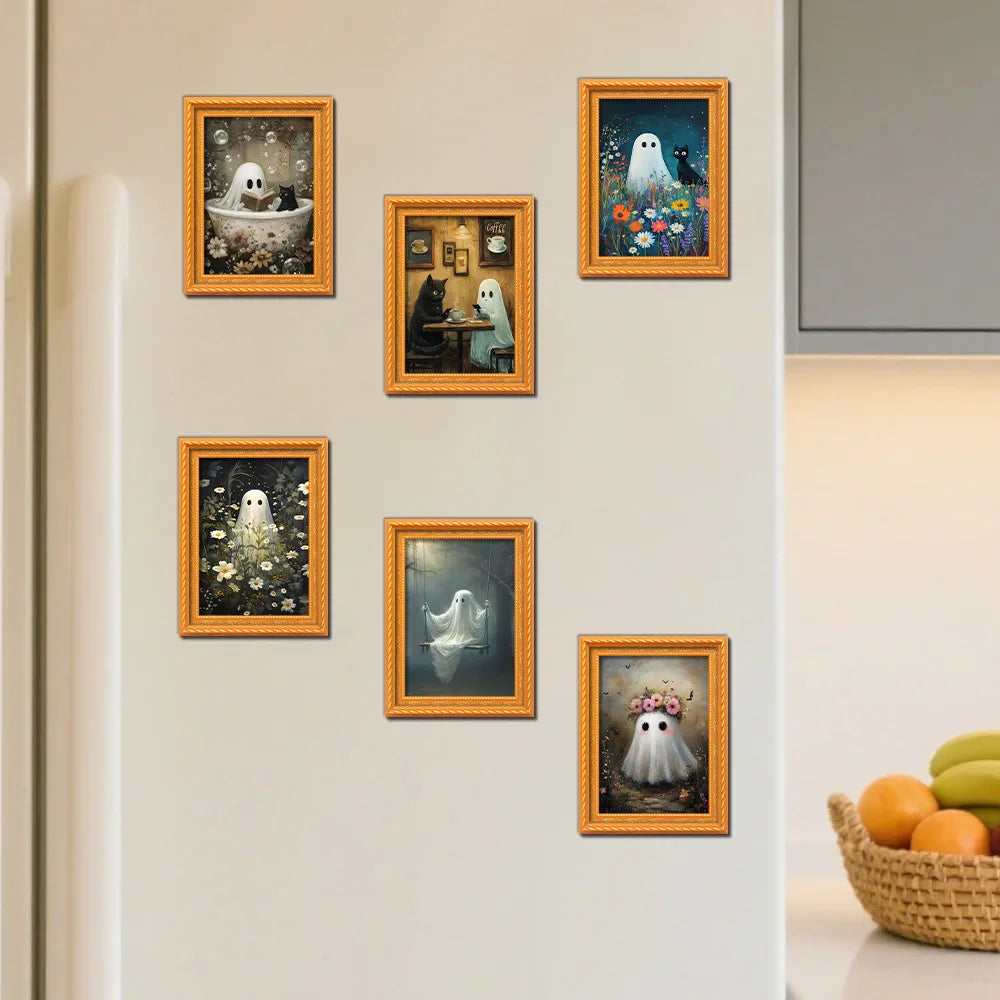 A collection of five framed prints featuring cute ghost Halloween themes displayed on a white refrigerator.