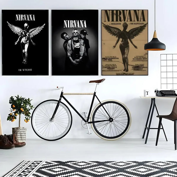 A vintage poster featuring the Nirvana band with winged figures and grunge aesthetic displayed on a wall.