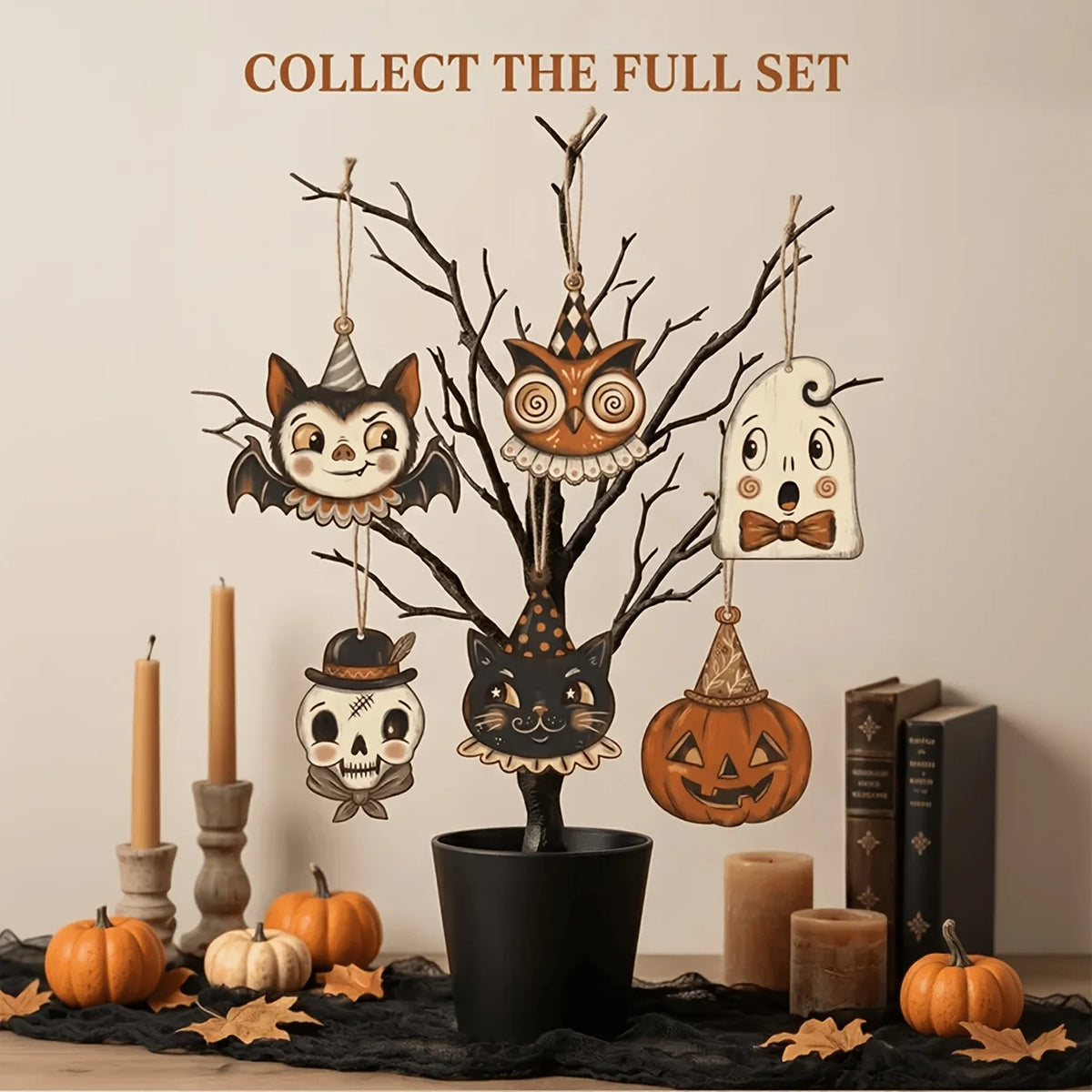 A set of vintage wooden Halloween hanging ornaments featuring a cat, skull, and owl, displayed on a dark surface.