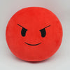 A round, bright red plush doll with a black, angry facial expression.