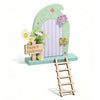 A wooden fairy elf door miniature decoration featuring a picket gate and a small ladder.