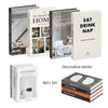 A set of four decorative faux books featuring titles like Japandi Living, The Monocle Book of Homes, Inspired by Nature, and 