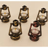 Four vintage ceramic miniature lanterns with glass bulbs and brass-colored metalwork for dollhouse décor