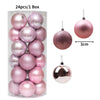 A box containing 24 pink and rose gold glitter Christmas tree ornament balls.