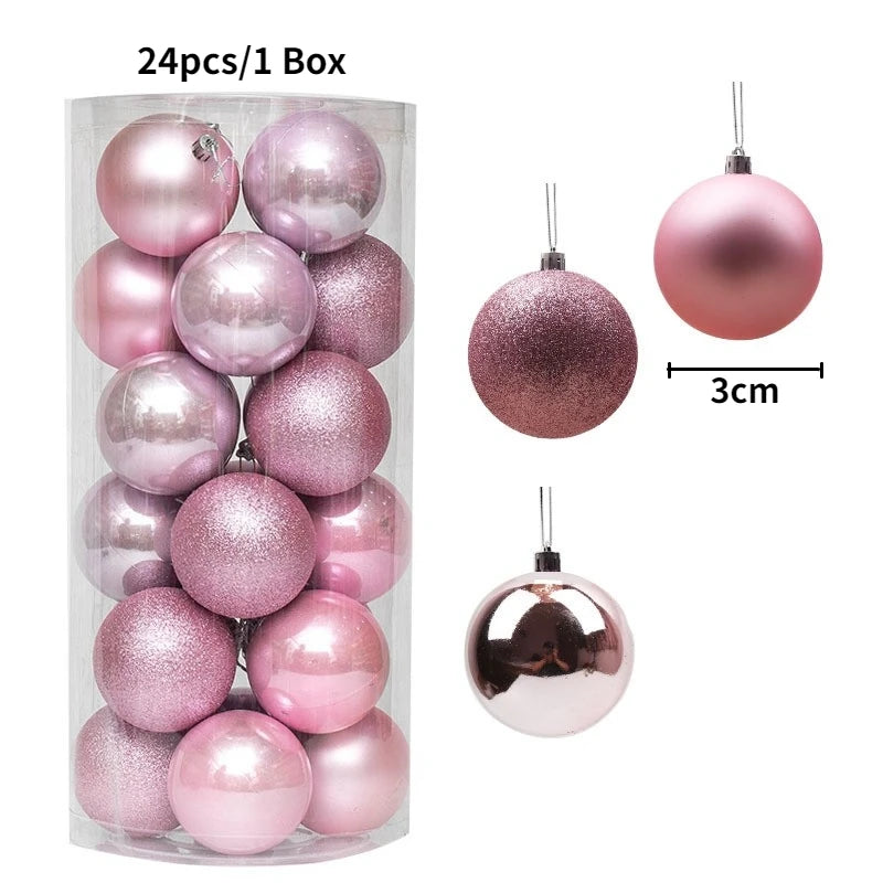 A box containing 24 pink and rose gold glitter Christmas tree ornament balls.
